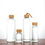 Custom logo Glass Water Bottle with Stainless steel and lid - Image 2