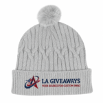 Sustainable cable knit beanie with a plush faux fur pom - Image 3