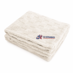 Plush ivory sherpa throw with checkered texture blanket